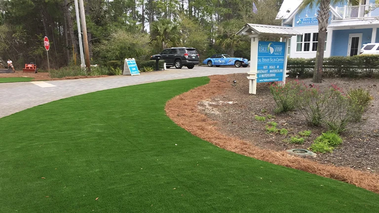 Southern Greens' professional artificial turf installation at a Knoxville commercial property, showcasing a pristine and sustainable landscape.